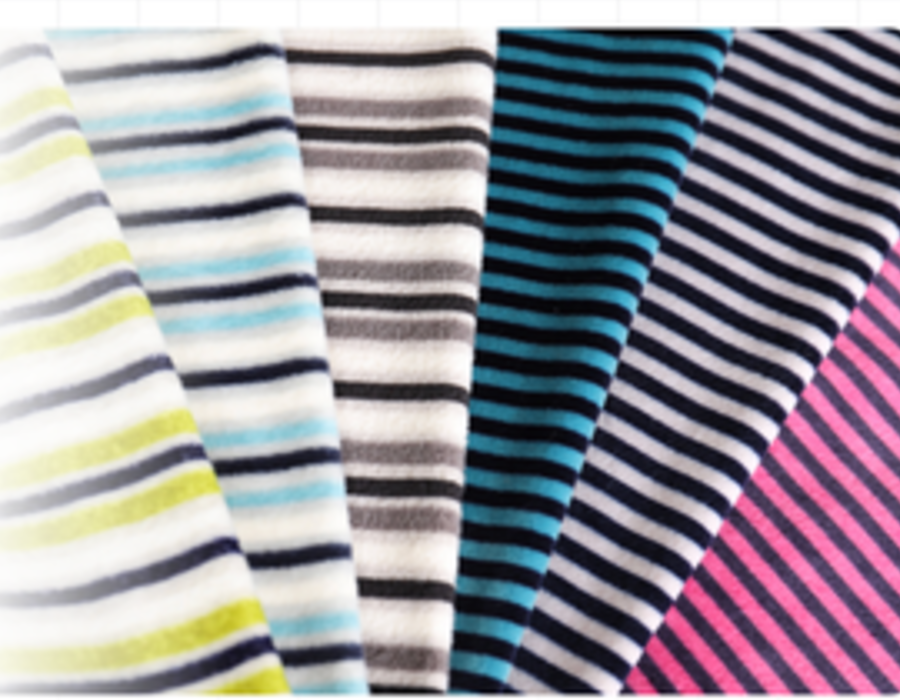 Fan of yarn-dyed striped knit swatches in multiple colourways.
