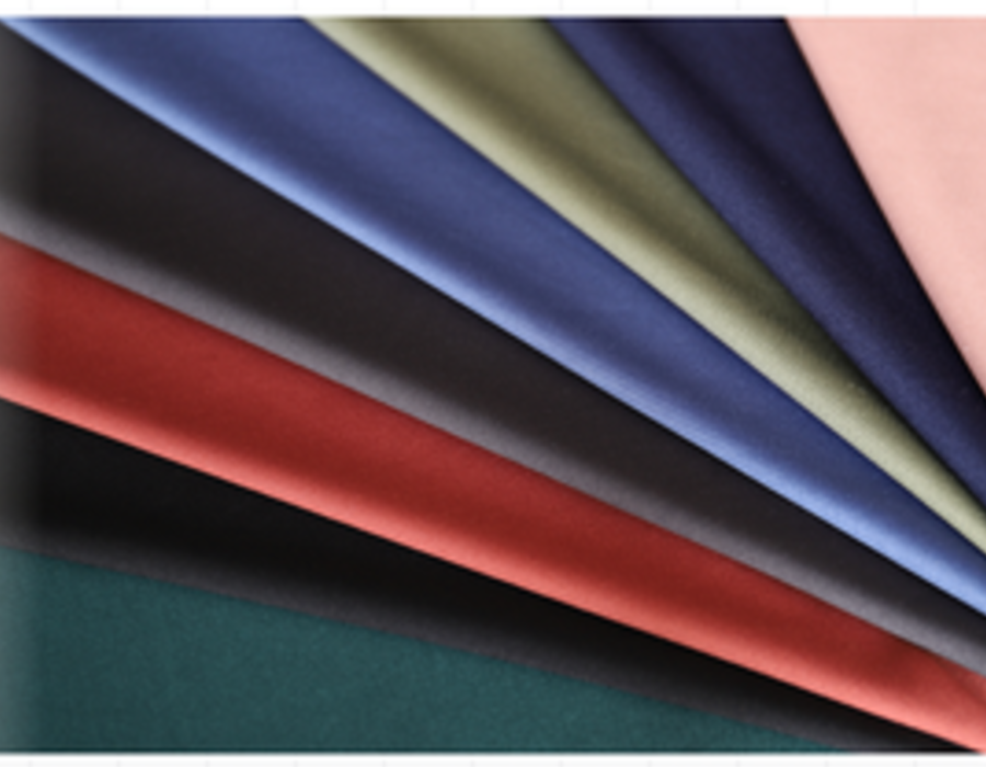 Fan of dense interlock swatches in deep solid colours.